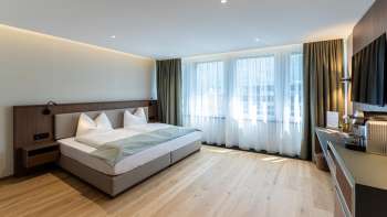 Moderne en gezellig ingerichte tweepersoonskamer in het Alpin Royal Hotel